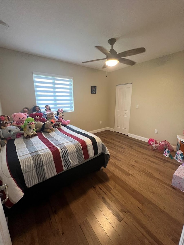 bedroom with hardwood / wood-style flooring and ceiling fan