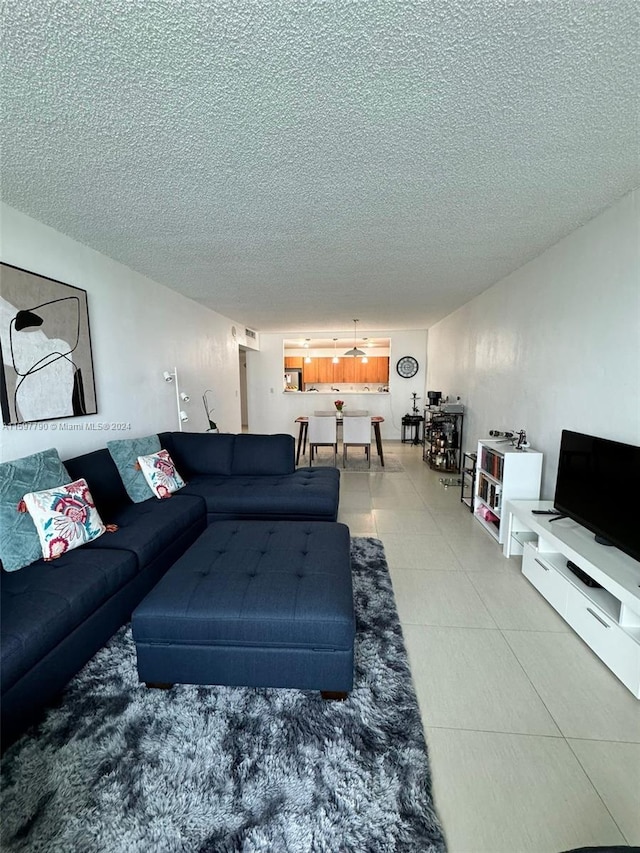 living room featuring a textured ceiling