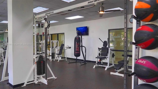 workout area with a paneled ceiling