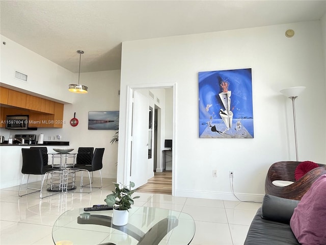 living room featuring light tile flooring