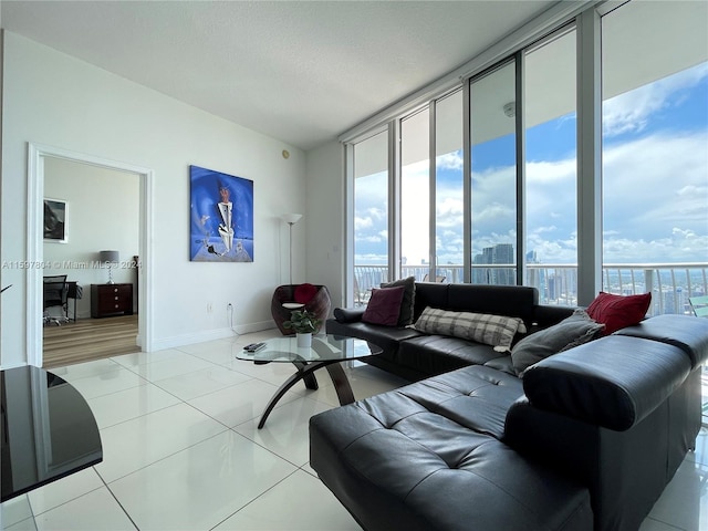 living room with light tile floors and expansive windows