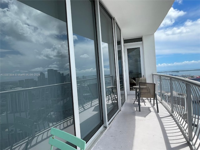 balcony featuring a water view