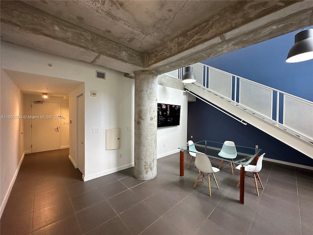 dining area with dark tile patterned floors