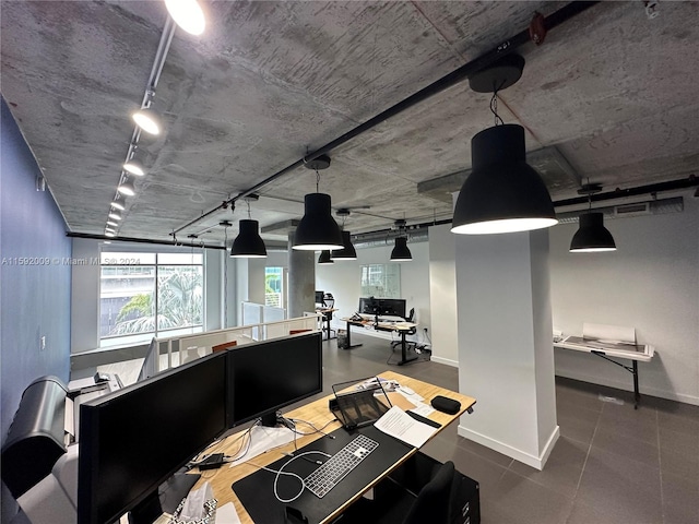 interior space featuring decorative light fixtures and rail lighting