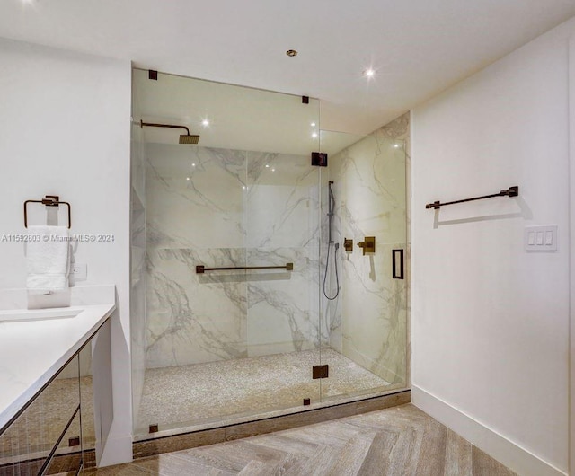 bathroom with vanity and a shower with shower door