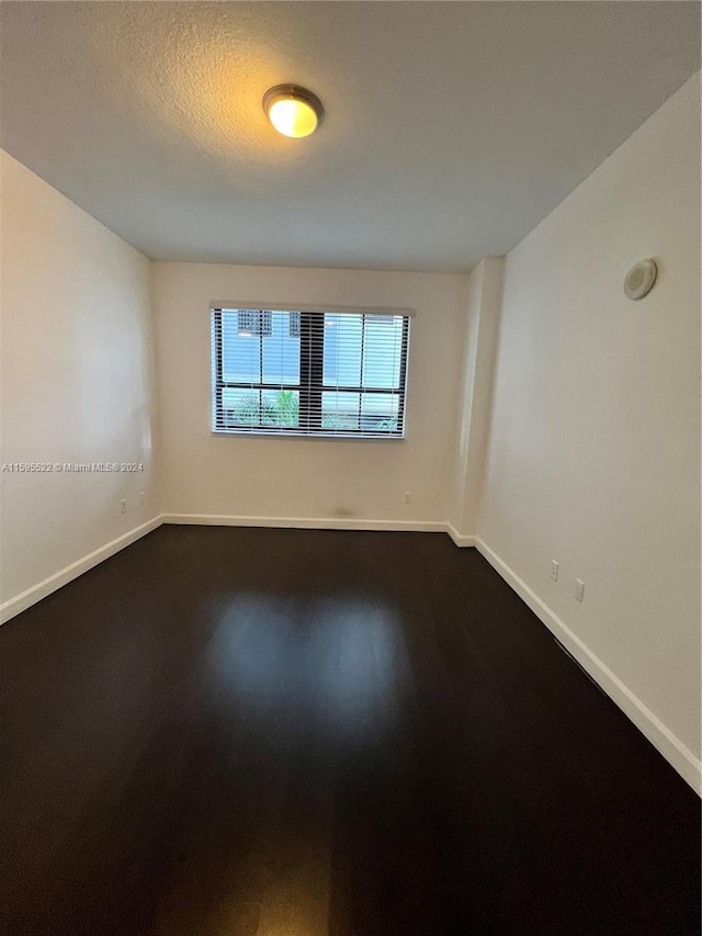 spare room featuring hardwood / wood-style flooring