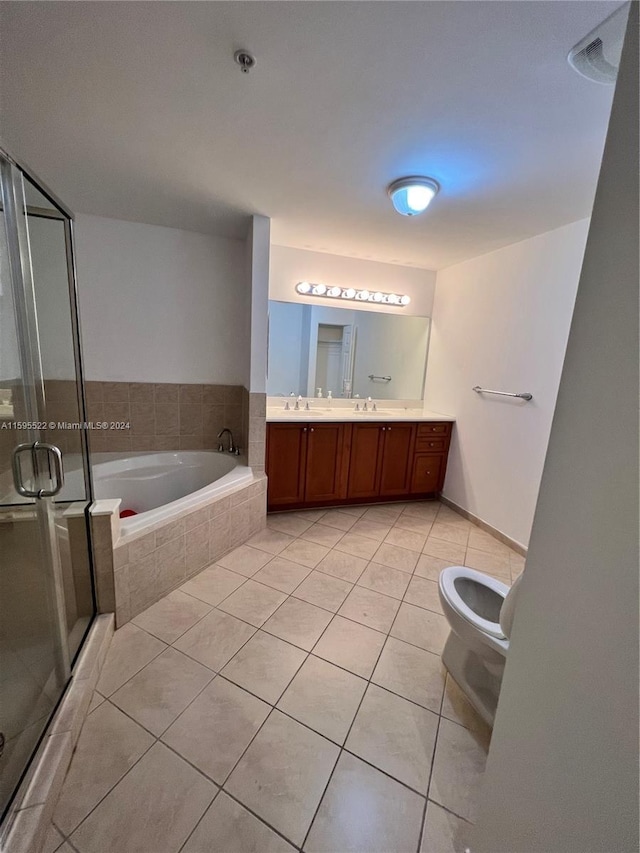 full bathroom featuring plus walk in shower, vanity, tile patterned floors, and toilet