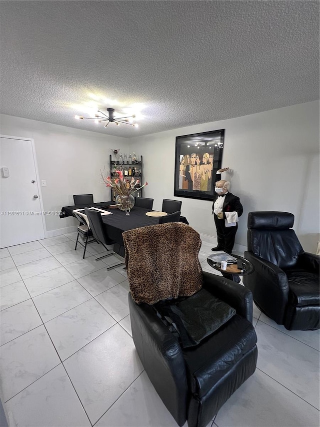 dining area featuring a textured ceiling and ceiling fan