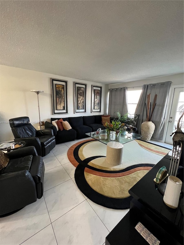 tiled living room with a textured ceiling