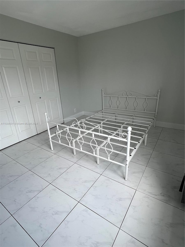 unfurnished bedroom with a closet