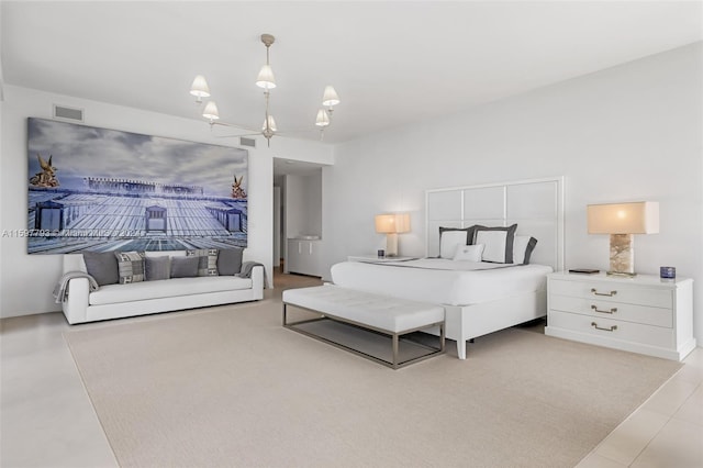 bedroom featuring light tile patterned flooring and a chandelier