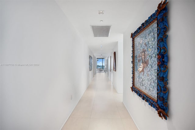 corridor featuring light tile patterned floors