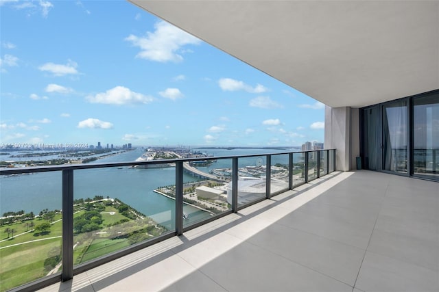 balcony featuring a water view