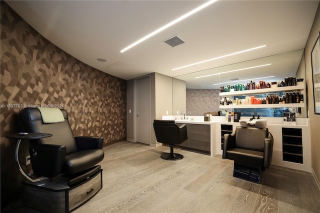 bar featuring light hardwood / wood-style flooring