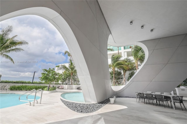 view of patio featuring a fenced in pool