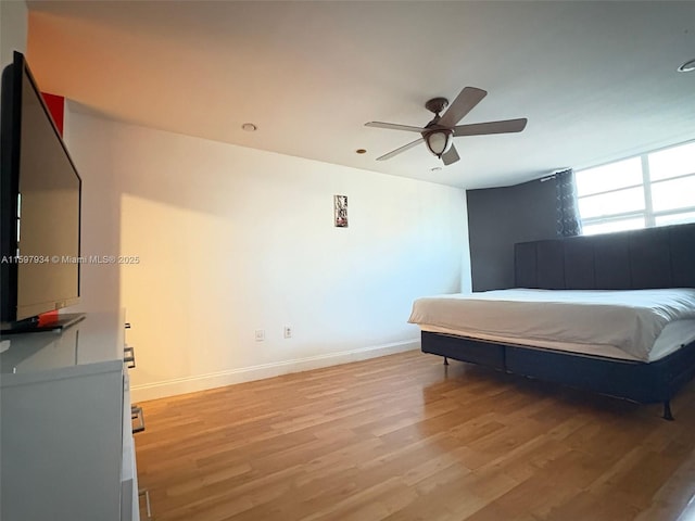 1965 S Ocean Dr Unit 2F, Hallandale Beach, FL 33009 - bedroom featuring baseboards, ceiling fan, and light wood-type flooring