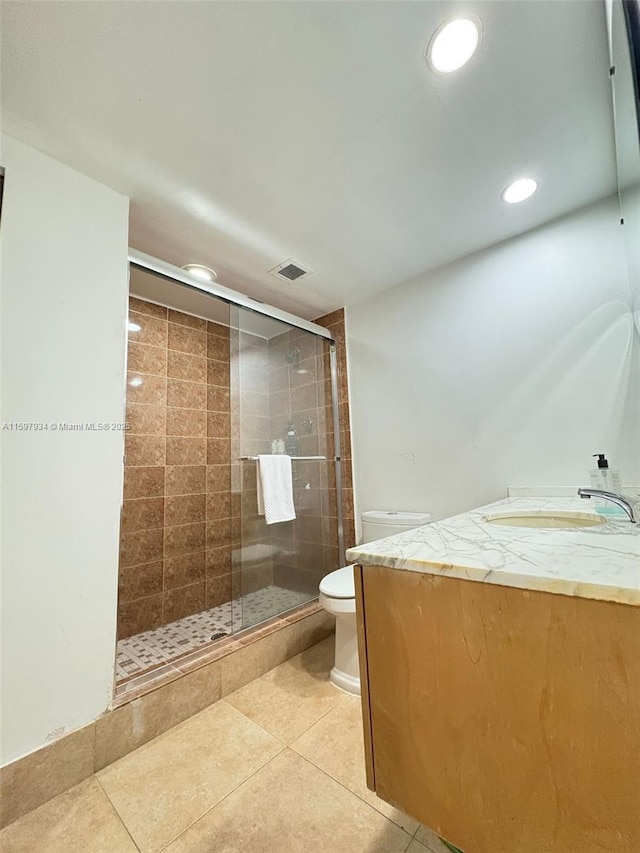 1965 S Ocean Dr Unit 2F, Hallandale Beach, FL 33009 - full bathroom featuring toilet, tile patterned flooring, and a shower stall