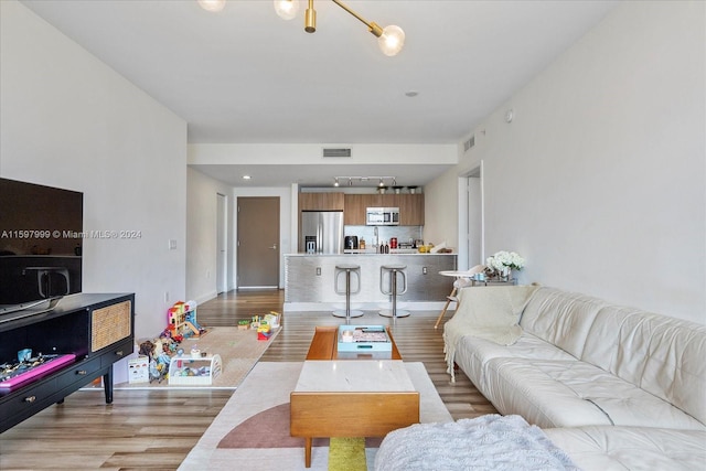 living room featuring light wood-type flooring