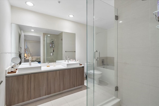 full bathroom featuring tile patterned flooring, vanity, separate shower and tub, and toilet