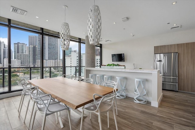 dining room with a wealth of natural light and floor to ceiling windows