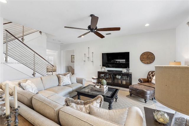 living room with ceiling fan and wood-type flooring