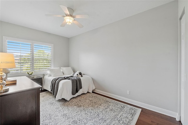 bedroom with wood-type flooring and ceiling fan