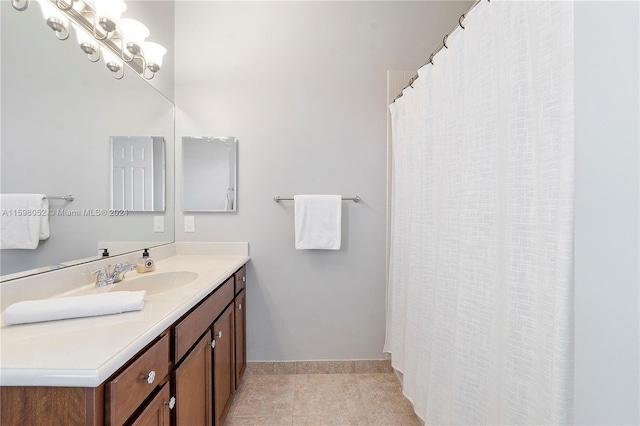 bathroom with tile patterned floors and vanity