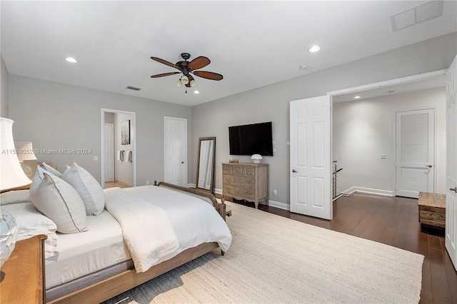 bedroom with ceiling fan and dark hardwood / wood-style floors