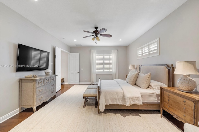 bedroom with hardwood / wood-style flooring and ceiling fan