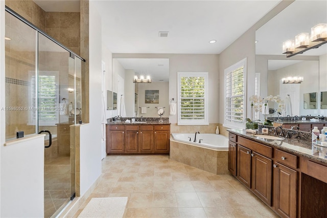 bathroom with tile patterned floors, vanity, and independent shower and bath