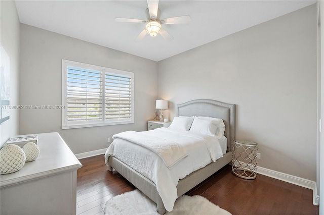 bedroom featuring ceiling fan and dark wood-type flooring