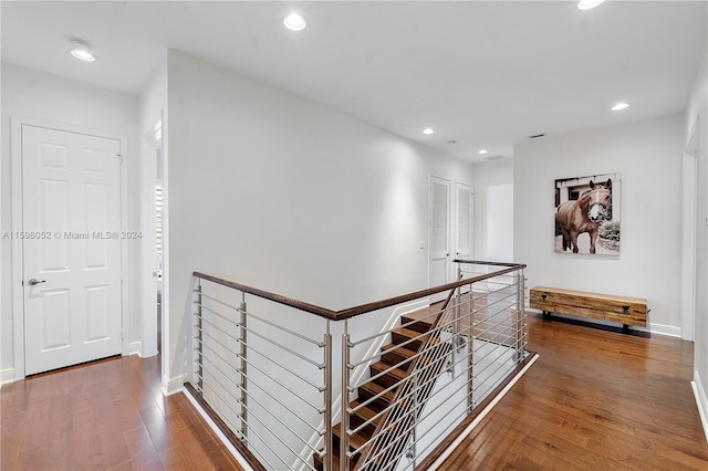 hall with dark wood-type flooring