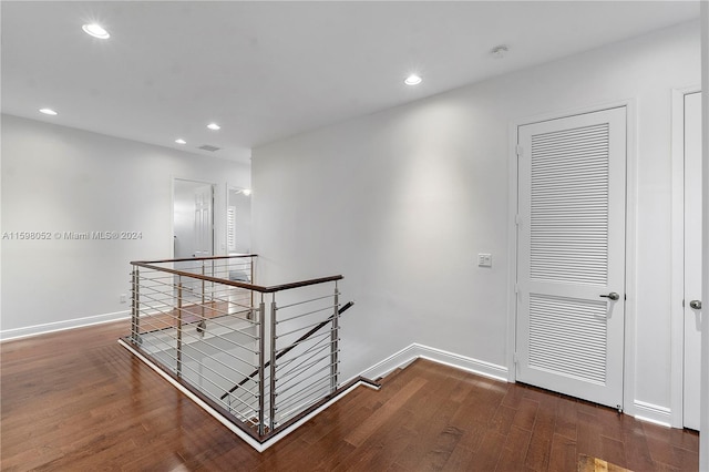 hall with dark wood-type flooring