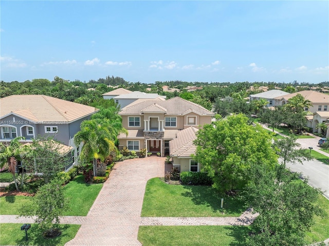 mediterranean / spanish home with a front yard