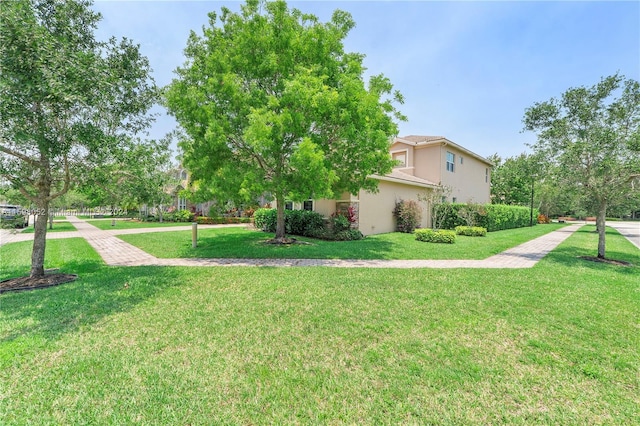 view of property exterior with a yard