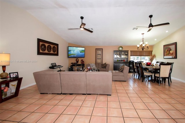 tiled living room with ceiling fan with notable chandelier and vaulted ceiling