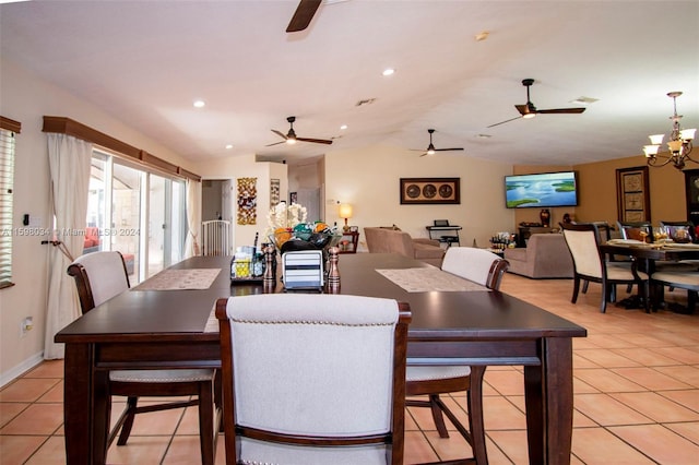 dining room featuring light tile patterned flooring, a chandelier, and vaulted ceiling