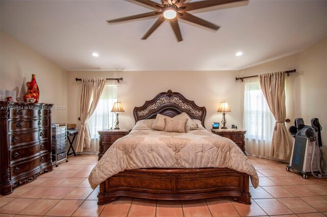 bedroom featuring light tile patterned floors and ceiling fan