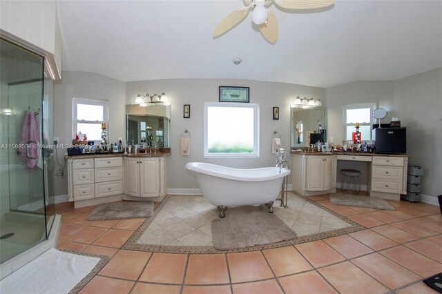 bathroom with vanity, lofted ceiling, tile patterned flooring, ceiling fan, and shower with separate bathtub