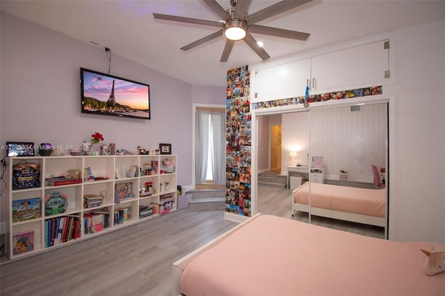 bedroom with light wood-type flooring and ceiling fan