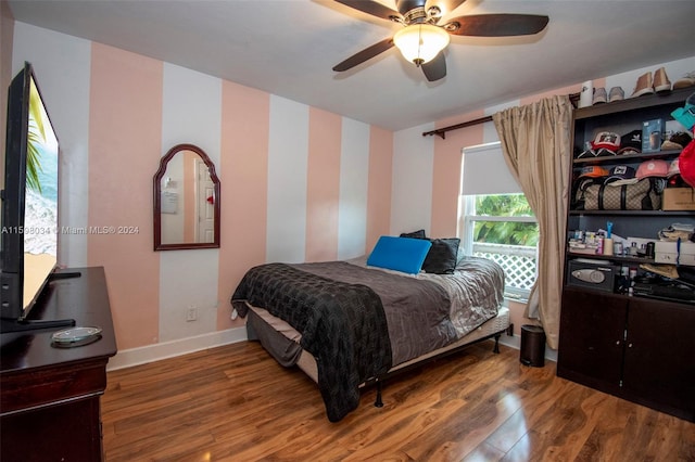 bedroom featuring ceiling fan and wood-type flooring