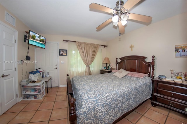 tiled bedroom with ceiling fan