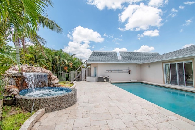 view of pool featuring a patio area and pool water feature