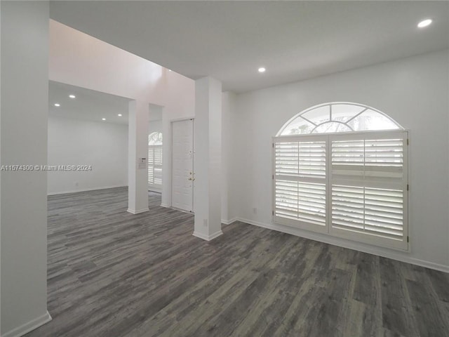 spare room featuring dark hardwood / wood-style flooring