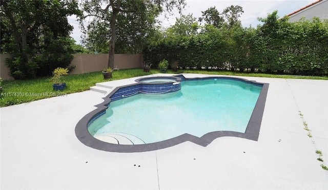 view of pool with an in ground hot tub