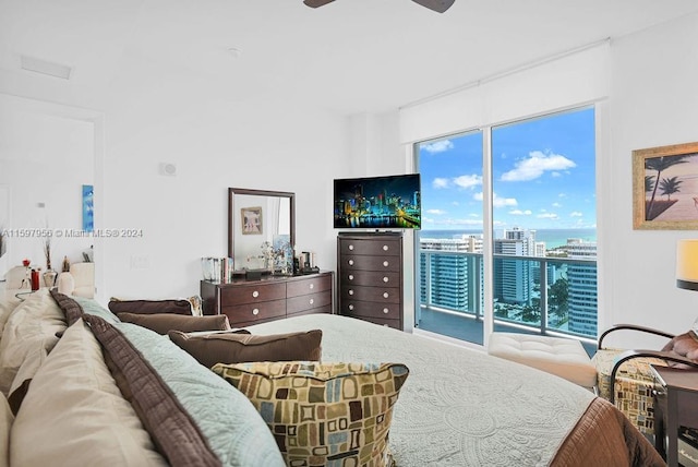 bedroom featuring ceiling fan and access to outside