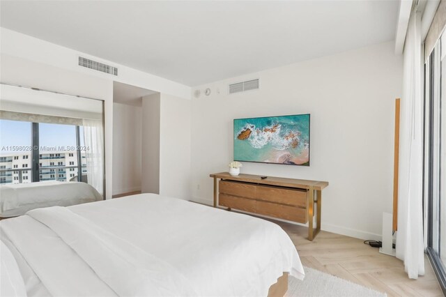 bedroom featuring light parquet floors