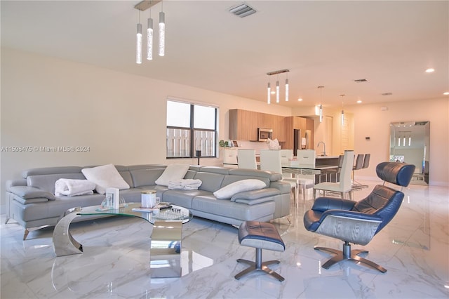 living room featuring sink