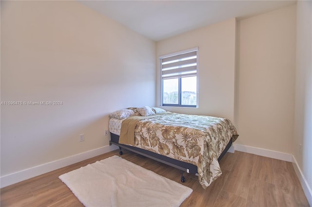 bedroom with light hardwood / wood-style floors