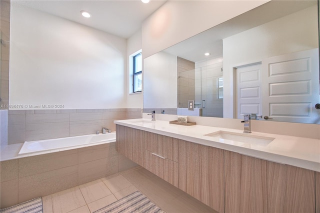 bathroom with vanity, tile patterned floors, and independent shower and bath